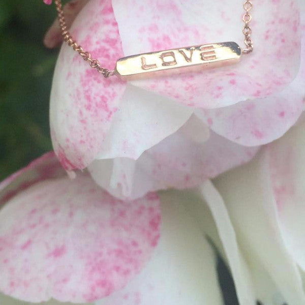 The BETH double sided bar bracelets are made by hand in solid 18K gold and 18k Italian gold chains. Available in rose, yellow and white gold. Made by hand in USA.