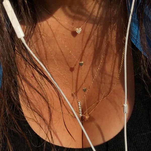 Paulina jewelry necklaces. The simply perfect diamond heart, the Devin blue hearts lariat and the Carrie diamond bar body chains. All made by hand in solid gold