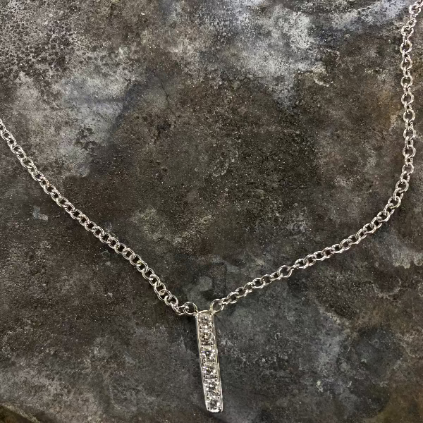 Made by hand in solid 18K white gold, Italian gold chains and brilliant diamonds