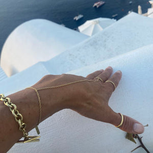 ring bracelet made by hand in solid 18K gold, 18K Italian gold chains and a  signature brilliant diamond on the solid gold tag