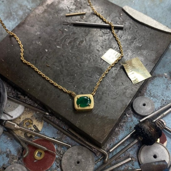 The Emerald necklace is crafted  by hand in solid 18K gold, 18K solid Italian gold chains and Emerald Stone. Made by hand in USA www.paulinajewelry.com