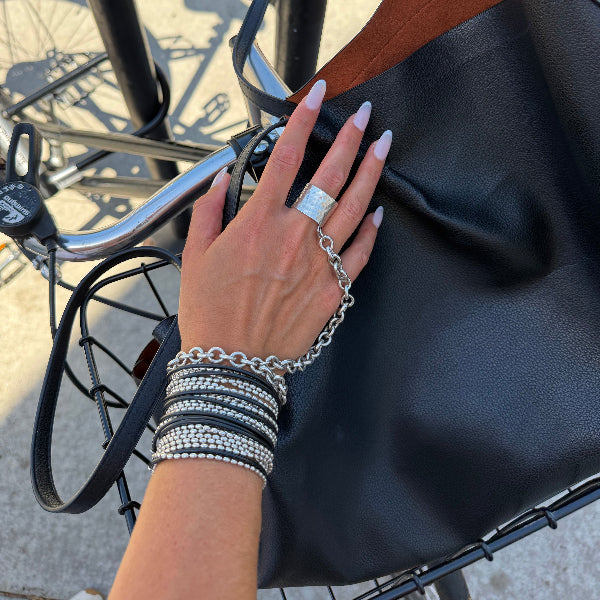 One piece ring bracelet crafted by hand in solid Italian sterling silver chains and Imported rubber. One of Paulina's signature pieces