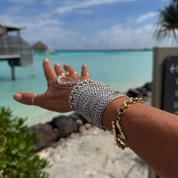 One piece ring bracelet crafted by hand in solid Sterling silver and Italian sterling silver chains. One of Paulina's signature bracelets