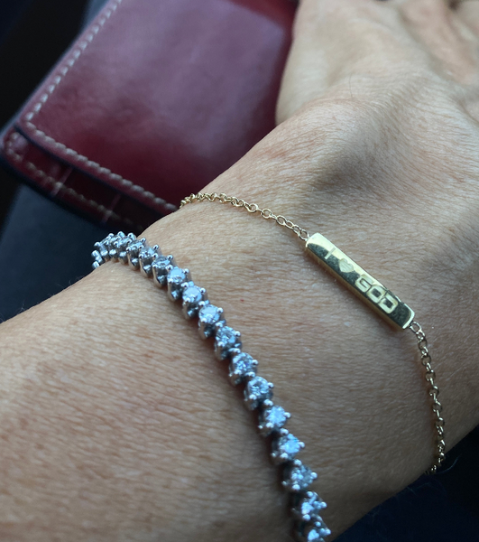 Hand crafted bracelet in solid gold and/ or sterling silver with Italian sterling silver chains. Has one word on one side and another in the other side