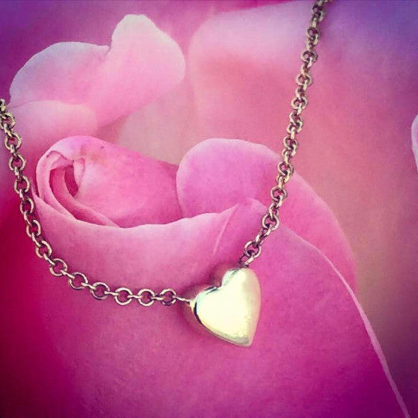 Dainty heart necklaces made by hand in solid 18k gold and 18K Italian gold chains. Available in solid rose, yellow and white gold and also with diamonds. Made by hand in U.S.A.  Free shipping on all domestic orders. 