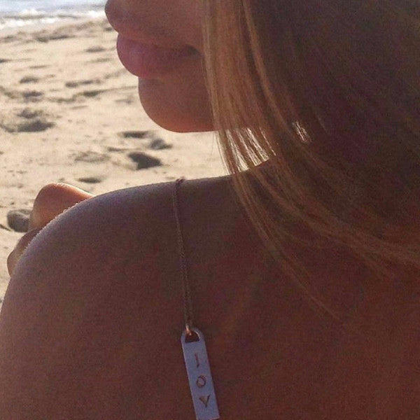 The Corrine ID tag necklaces are made by hand in solid 18K gold and 18K Italian gold chains. They are available in solid 18k rose, yellow and white gold and also custom made with diamonds. Made by hand in USA. Expected shipping 3- 5 business days.