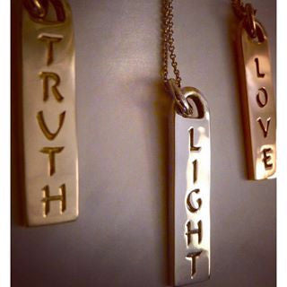 The Corrine ID tag necklaces are made by hand in solid 14k and 18K gold and Italian gold chains. They are available in solid 18k rose, yellow and white gold and also custom made with diamonds. Made by hand in USA. Expected shipping 3- 5 business days.