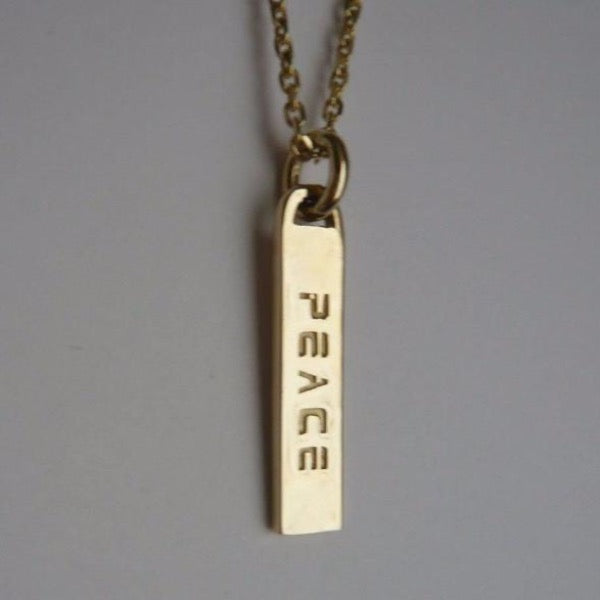 The DREW double sided ID tag necklaces are made by hand in solid 18k gold and 18k Italian gold chains. Made by hand in USA. Among available ones: BREATHE/PEACE   JUST BE/LOVE  CHOOSE/FREEDOM  UPWARD/ONWARD   I AM/DIVINE   LET GO/ LET GOD etc...Made by hand in USA