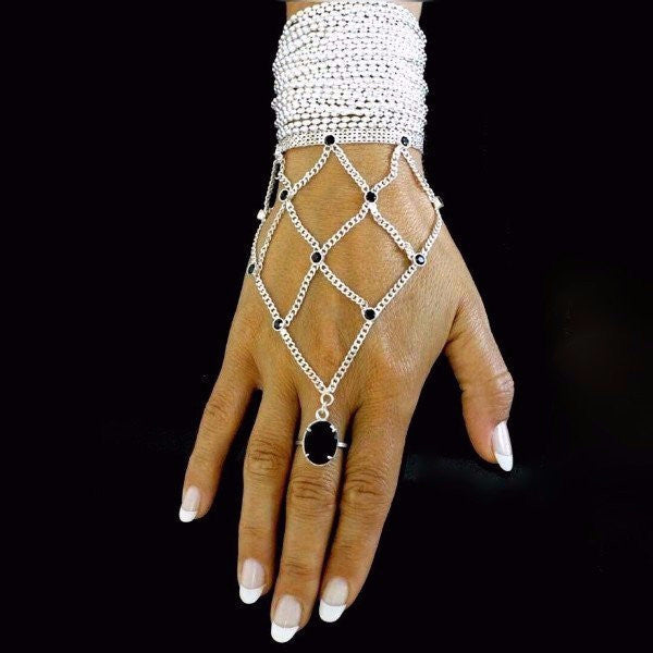 The Reymi ring bracelet by PAULINA jewelry is made by hand in solid sterling silver, Italian sterling silver chains and stones. Made by hand and to order in U.S.A. Available with different kind of stones. Expected shipping 10-14 business days.