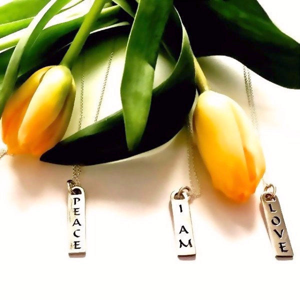 The Corrine Id Tag Necklaces in solid sterling silver & Italian silver chains. Also available in solid gold and custom made with diamonds. Among available ones...Thrive - I Am/ Love - Light  - Faith - Truth- Joy- Peace - Paix - Joie - Surrender - Trust....etc...Made by hand in USA. Free shipping within the US