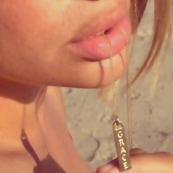 The Corrine ID tag necklaces are made by hand in solid 18K gold and 18K Italian gold chains. They are available in solid 18k rose, yellow and white gold and also custom made with diamonds. Made by hand in USA. 