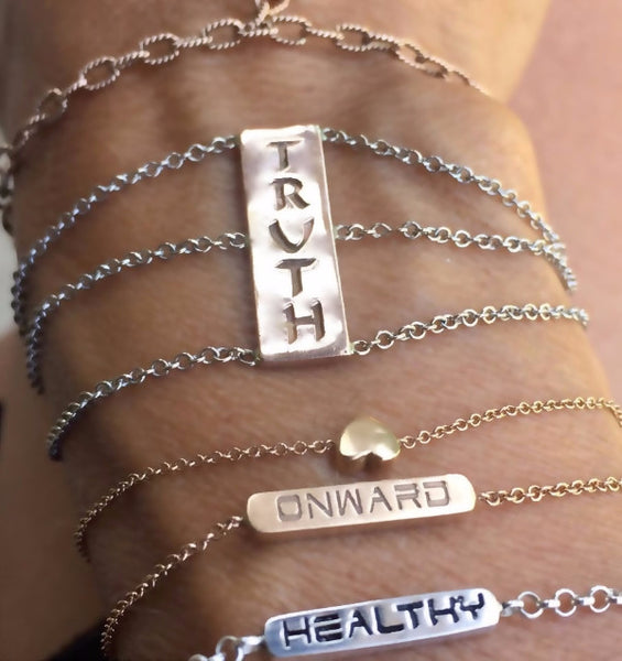 The BETH double sided bar bracelets are made by hand in solid 18K gold and 18k Italian gold chains. Available in rose, yellow and white gold. Made by hand in USA. 