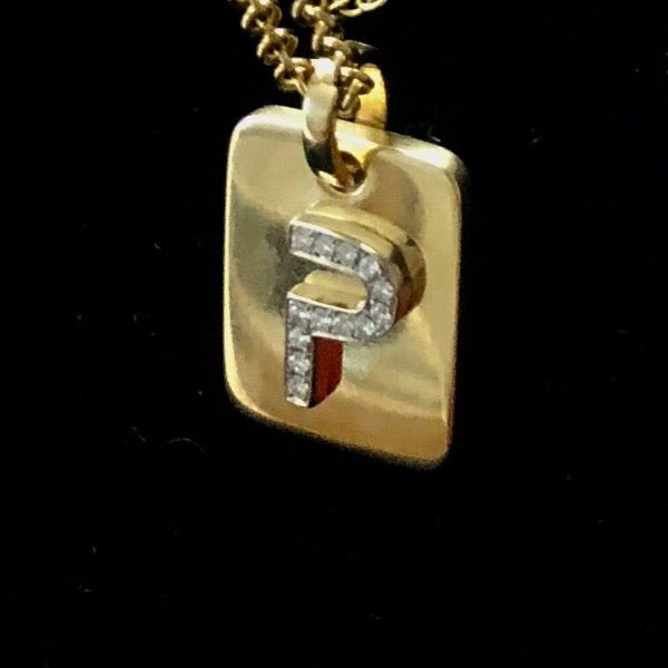 Dog tags by Paulina jewelry . Made by hand in solid gold and diamonds