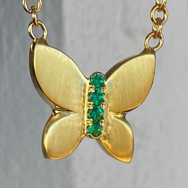 The JJ Butterfly made by hand in solid 18K gold and Emerald stones